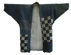 A Patched and Mended Indigo Cotton Jacket: Some Surface Loss
