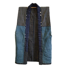 A Lightly Padded Sleeveless Garment: Piece Constructed Cotton